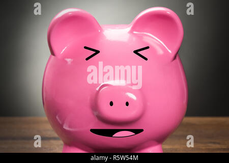 Piggybank con la calcolatrice Foto Stock