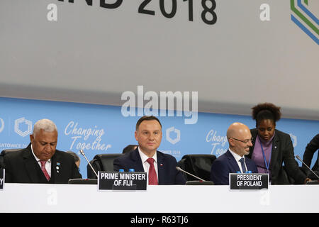 L-R Frank Bainimarama, Primo ministro delle Figi, Andrzej Duda, Presidente della Polonia, e Michal Kurtyka, presidente di COP 24 conferenza, sono visibili durante il Foto Stock