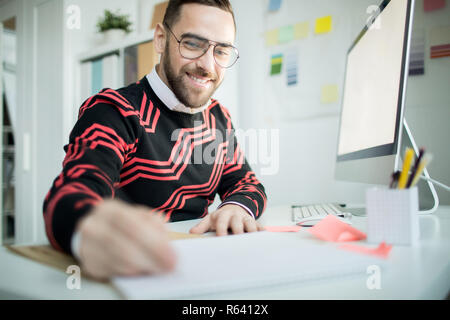 Intraprendente manager a scrivere le idee Foto Stock