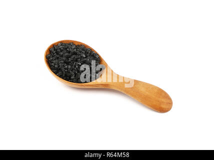 Chiudere il cucchiaio di legno di colore nero di sale hawaiano Foto Stock