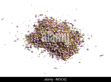 Erbe officinali essiccate materie prime isolato su bianco. Fiori di Calluna vulgaris, noto come comuni heather, ling, o semplicemente heather Foto Stock