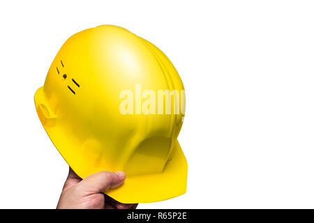 Costruzione casco di protezione della testa in mano agli uomini Foto Stock