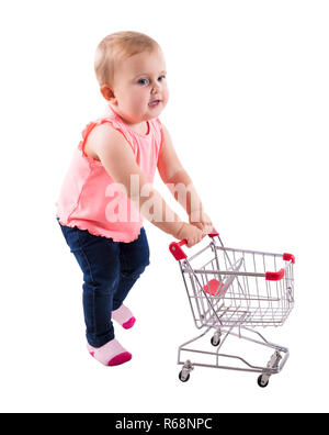 Baby girl Holding piccolo carrello Foto Stock