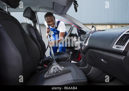 Tuttofare aspirare auto sedile anteriore Foto Stock