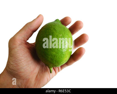 Limone in mano Foto Stock