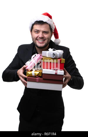 Immagine di uomo felice in santa hat con scatole con doni in mani Foto Stock