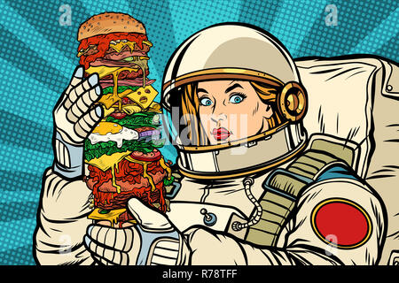 Fame donna astronauta con il gigante Burger Foto Stock