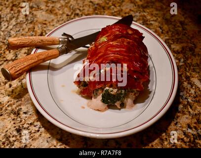 Carne arrosto di maiale ripiene di spinaci Foto Stock