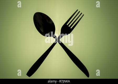 Sagome di attraversata cucchiaio e forchetta Foto Stock