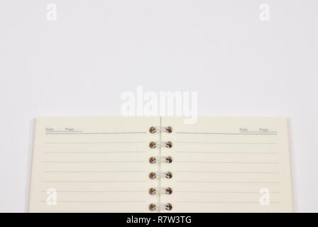 Concetto di registrazione dei vostri affari quotidiani. Blocco Note su uno sfondo bianco. Copiare il layout dello spazio Foto Stock