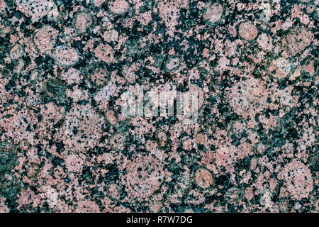 La pietra naturale. In granito rosa. Granito nero. Il Granito grigio. Il materiale di rivestimento. Texture in granito. Disco luminoso di roccia di granito texture. Pietra di granito sullo sfondo Foto Stock