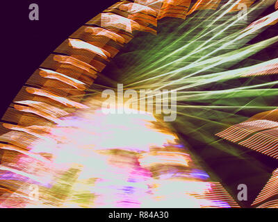 La Grande Roue, aka ruota panoramica Ferris, nel quartiere fieristico Tuileries, Parigi, Francia: movimento sfocata di notte Foto Stock