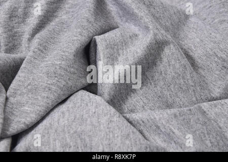 Close-up grigio t-shirt in cotone sfondo piega Foto Stock