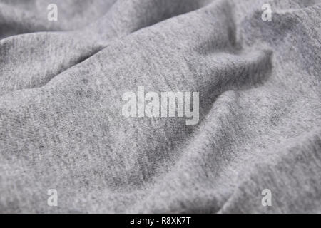 Close-up grigio t-shirt in cotone sfondo piega Foto Stock