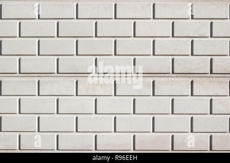 Di cemento grigio con recinto a forma di mattone di texture. La recinzione è stata assemblata di elementi prefabbricati. Foto Stock