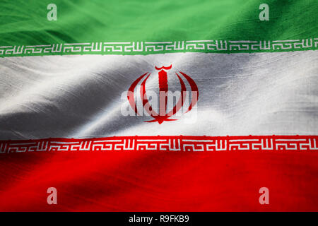 Primo piano della increspato Iran Bandiera, Iran bandiera soffiando nel vento Foto Stock