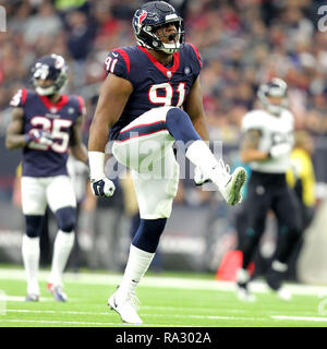 Houston, Texas, Stati Uniti d'America. 30 Dic, 2018. Houston Texans difensivo fine Carlos Watkins (91) celebra un grande gioco sulla difesa durante il quarto trimestre di NFL stagione regolare il gioco tra la Houston Texans e Jacksonville Jaguars a NRG Stadium di Houston, TX su dicembre 30, 2018. Credito: Erik Williams/ZUMA filo/Alamy Live News Foto Stock