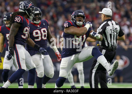 Houston, TX, Stati Uniti d'America. 30 Dic, 2018. Houston Texans difensivo fine Carlos Watkins (91) celebra dopo un placcaggio per la perdita nel corso del quarto trimestre a fronte di Jacksonville Jaguars a NRG Stadium di Houston, TX. John Glaser/CSM/Alamy Live News Foto Stock