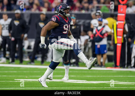 Houston, TX, Stati Uniti d'America. 30 Dic, 2018. Houston Texans difensivo fine Carlos Watkins (91) festeggia dopo aver apportato un sacco durante il quarto trimestre di NFL di una partita di calcio tra Jacksonville Jaguars e Houston Texans al NRG Stadium di Houston, TX. I Texans hanno vinto il gioco 20 a 3.Trask Smith/CSM/Alamy Live News Foto Stock