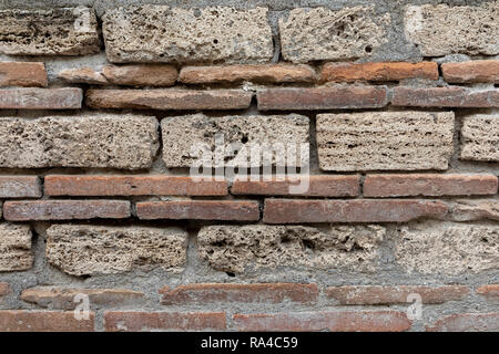 Primo piano della muratura in una casa romana muro a Pompei Foto Stock