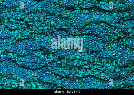 Grandi paillettes olografiche sul classico sfondo blu Foto stock - Alamy