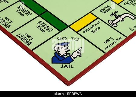 Close up dettaglio di un angolo del campo di gioco per il gioco del Monopoli che mostra per andare in prigione Foto Stock