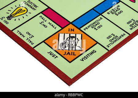 Close up dettaglio di un angolo del campo di gioco per il gioco del Monopoli che mostra in carcere e soltanto in visita Foto Stock