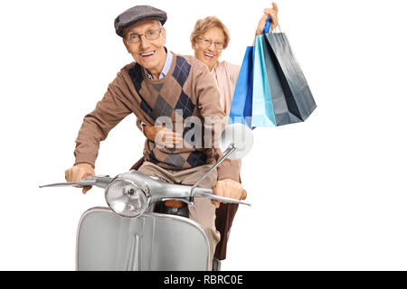 Uomo anziano in sella a una moto-scooter attraverso Alicante città vecchia  Foto stock - Alamy