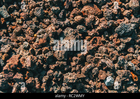 Dettaglio di rocce vulcaniche sul terreno Foto Stock