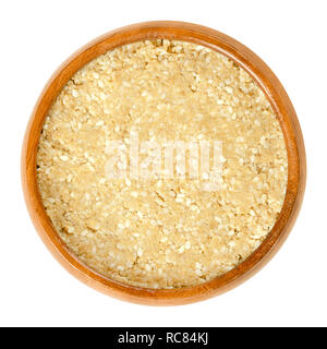 In casa di tahin bianco con semi di sesamo nella ciotola di legno. Condimento fatto di terra di riso semigreggio di semi di sesamo. Dip. Ingrediente in hummus, Baba ghanoush, halva. Foto Stock