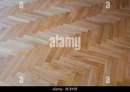 Pavimenti in parquet di sfondo - heringbone pavimento in parquet Foto Stock