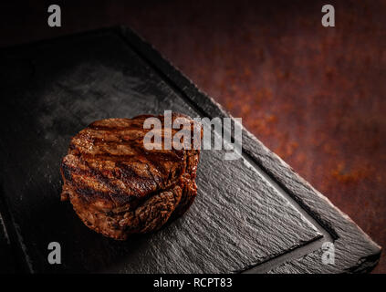 Maturato argentino ribeye sul nero ardesia board Foto Stock