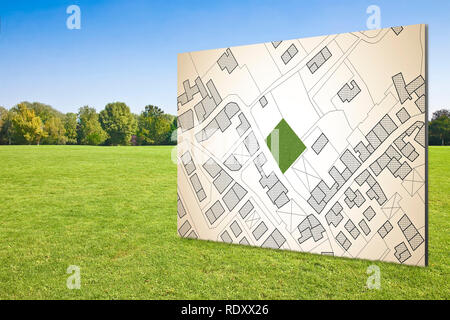 Immaginaria mappa catastale del territorio con una libera terra verde disponibile per la costruzione di edifici sul verde prato falciato - Concetto di immagine Foto Stock