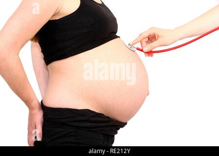 Donna incinta, 9 mese Foto Stock