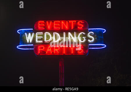 Eventi, matrimoni, cerimonie retrò al neon pubblicità segno venue Foto Stock