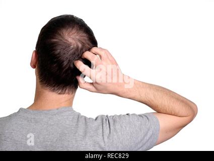 Uomo di graffiare il retro della sua testa Foto Stock