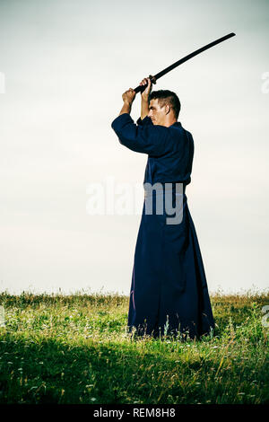 Kendo fighter holding bokuto Foto Stock