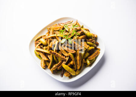 Sabzi Tindora / Tendli / RFI tondli noto anche come Ivy Gourd fry ricetta. Il fuoco selettivo Foto Stock