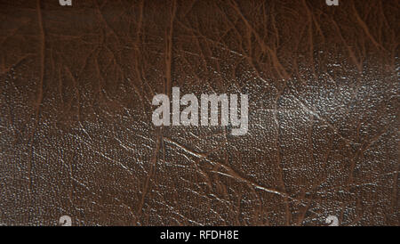 Superficie decorativa imitando artificialmente realizzata in pelle. La foto è stata scattata nelle ore diurne, primo piano. Foto Stock