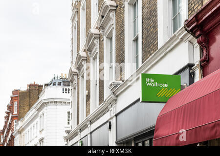 London, Regno Unito - 16 Settembre 2018: Vicinato negozio locale poco Waitrose upscale costosi segno verde dal droghiere storefront esterno facciata ent Foto Stock