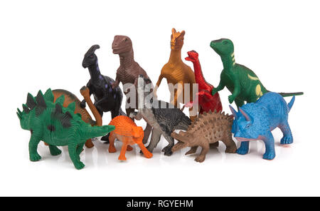 Gruppo di dinosauri giocattolo su sfondo bianco Foto Stock