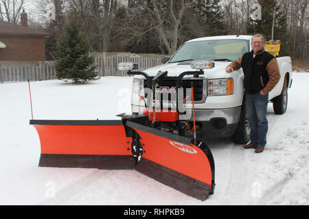 Snow Plough business operatore Foto Stock