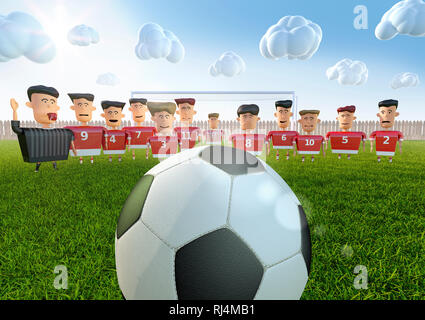 Ein großer Fussball vor Spielerfiguren in rotem Trikot nebst Schiedsrichter auf Bolzplatz und sonnig bewölktem Wetter Foto Stock