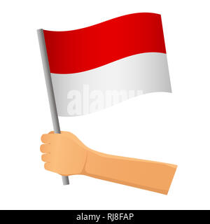 Bandiera dell'Indonesia in mano. Sfondo patriottico. Bandiera nazionale di Indonesia illustrazione Foto Stock