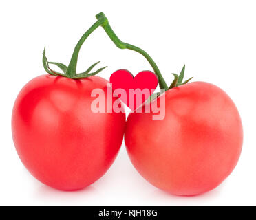 Pomodori isolato su uno sfondo bianco con un cuore Foto Stock