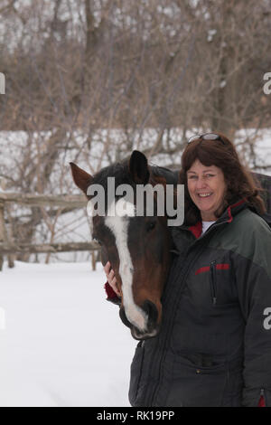 Equitazione invernale Foto Stock