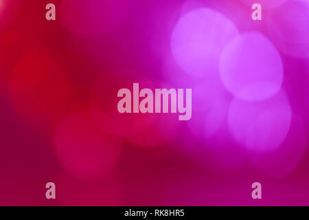 Abstract sfondo di rosso e rosa con toni bokeh di fondo. Foto Stock
