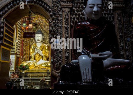 Monywa, Myanmar - 24 Settembre 2016: Statue di Buddha all'interno Thanboddhay Paya tempio principale Foto Stock
