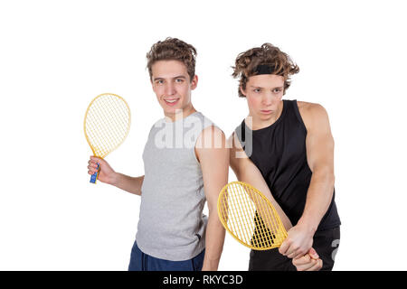 Due ragazzi bello giocare a tennis isolato Foto Stock