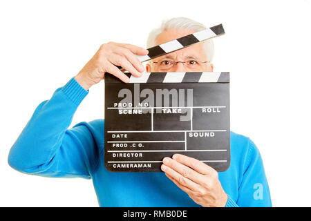 L'uomo come un direttore appare attraverso un lembo di film Foto Stock